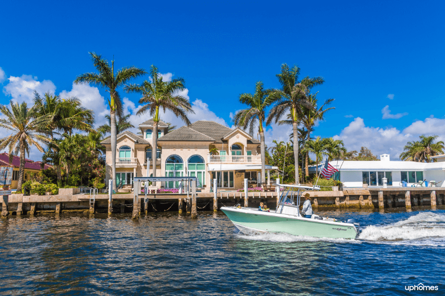 Homes in Florida on the water whether it's the ocean or a lake and a boat in the backyard with a pier