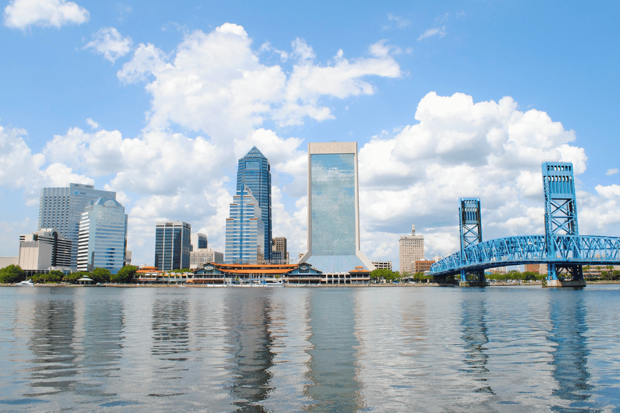view of the city of Jacksonville, FL from the bay on a sunny day