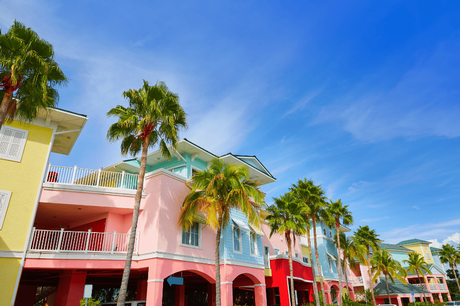 bright and colorful buildings in Fort Myers, FL with palm trees