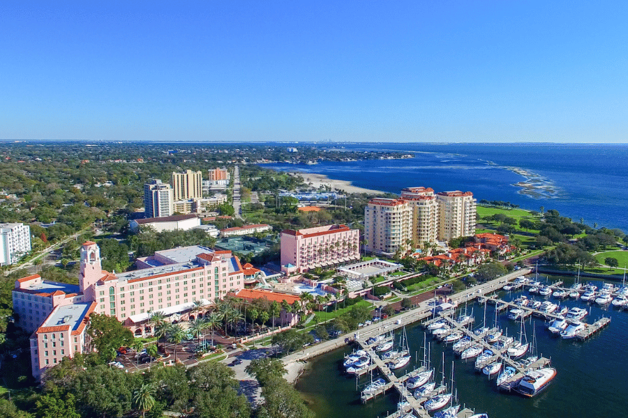Aerial view of St. Petersburg, FL overlooking the water and buildings 