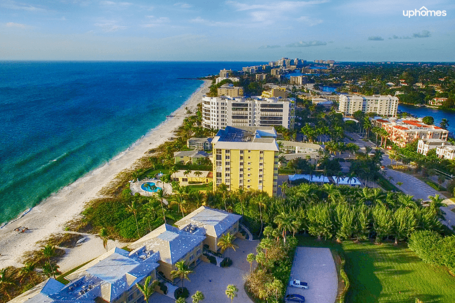 Aerial view of Naples Florida with the beach and the city skyline on a sunny day