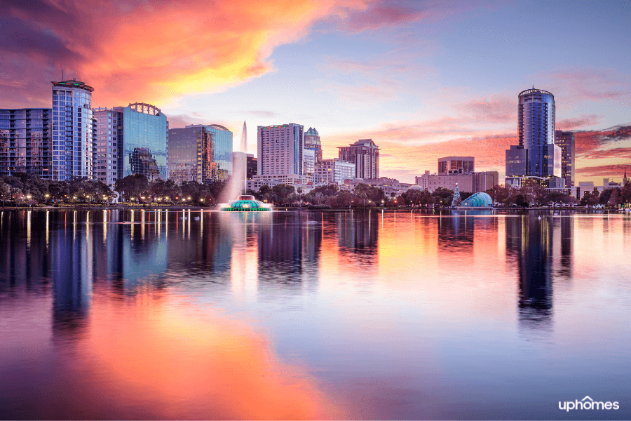 Orlando, Florida at sunset with a photo of the water and downtown buildings in the background Orlando, Florida at sunset with a photo of the water and downtown buildings in the background
