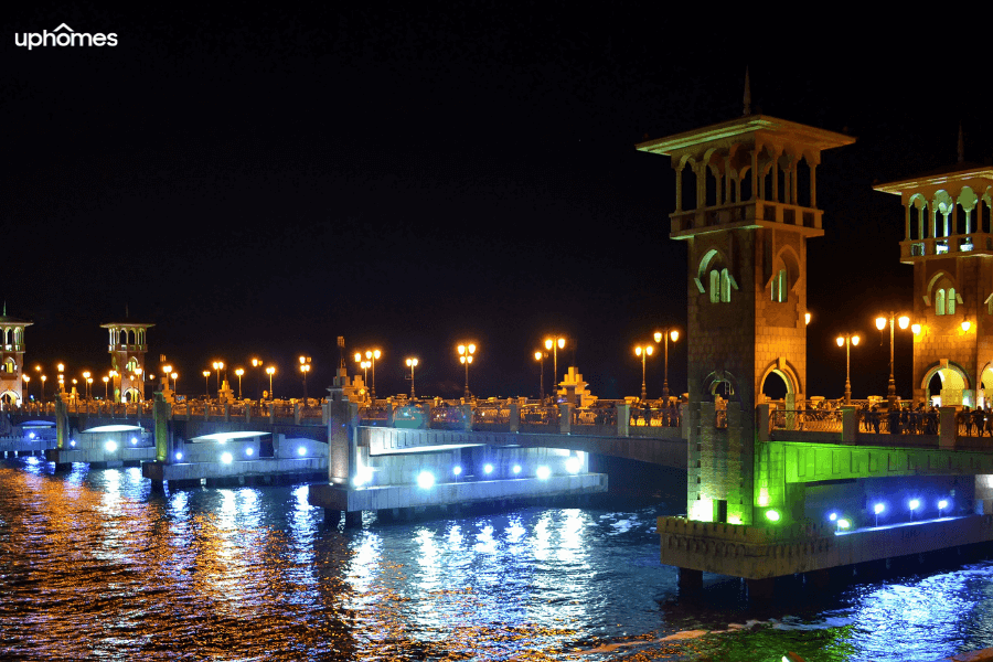 Waterfront of the city of Alexandria at night time with city lights