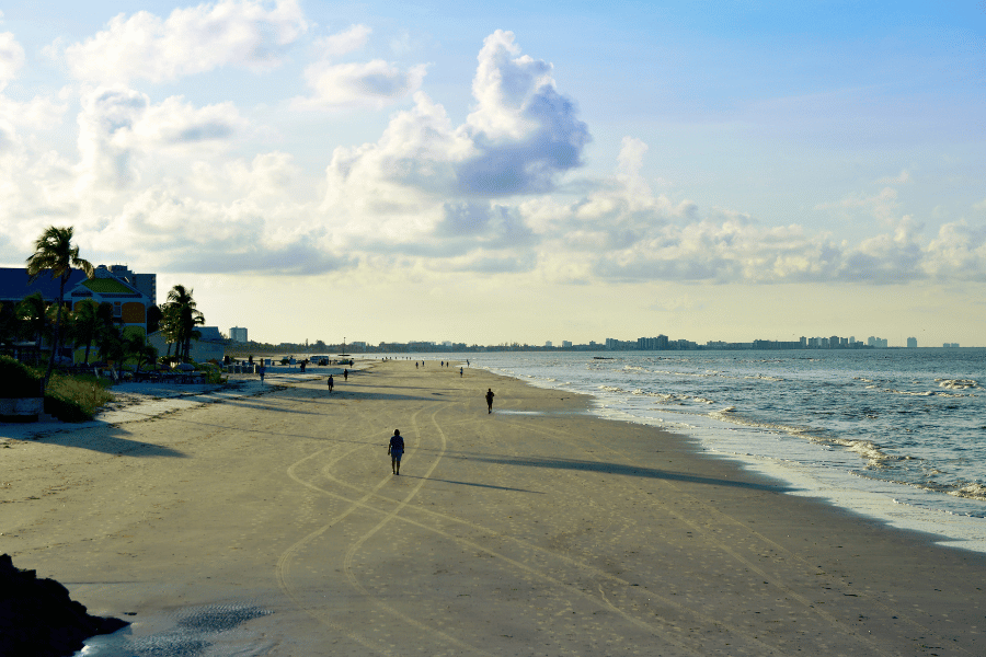 Fort Myers Beach sunrise people walking on the beach