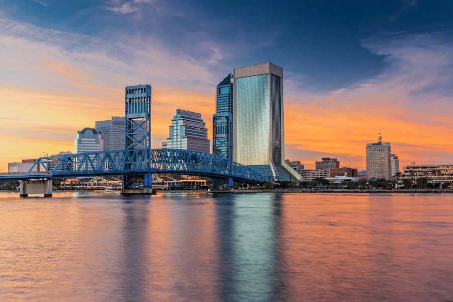 Jacksonville, FL, skyline and bridge during a beautiful orange sunset