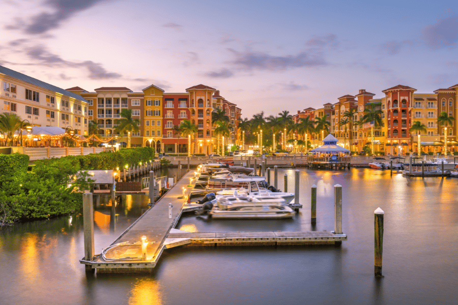 Naples, FL Naples, FL at sunset with palm trees and boats