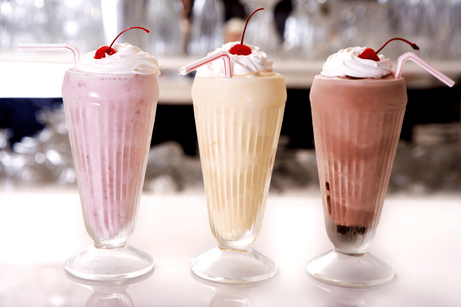 three milkshakes strawberry vanilla and chocolate 